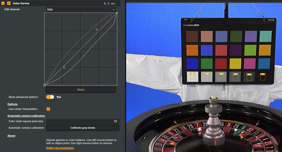 Six yellow square markers positioned over the grey patches of a colour calibration chart