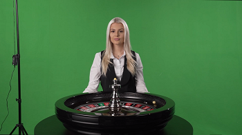 Source scene — green backdrop, roulette wheel with green "0", tripod on the left